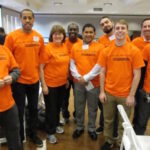Kent McKeever, back row second from the right, and colleagues and friends at Mission Waco, pose with the orange T-shirt designed to inspire fair hiring polices for ex-cons. (Photo provided by Kent McKeever)